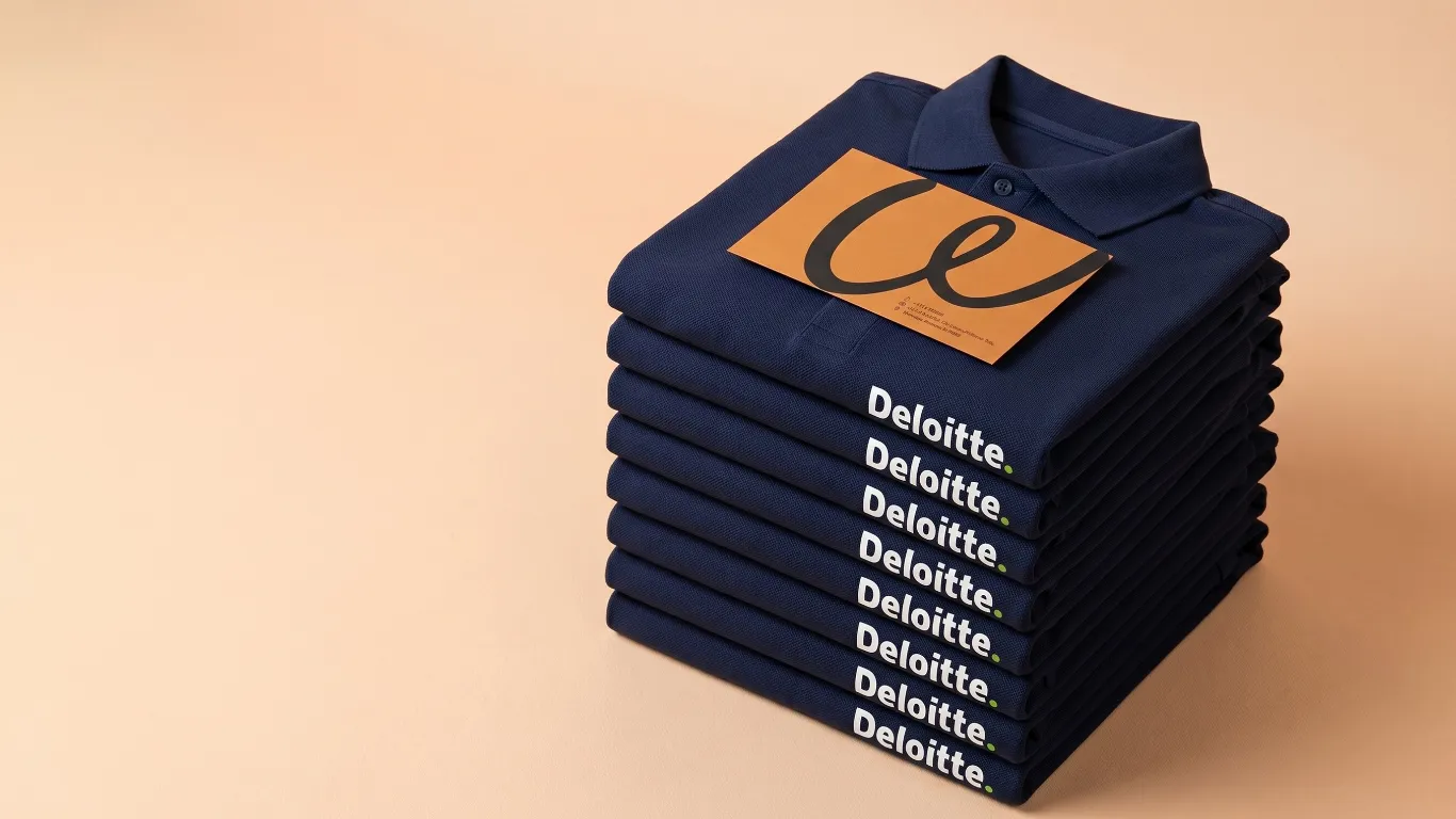 Premium corporate polo shirts stacked with custom logo